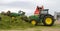 John Deere tractor pushing silage at the clamp