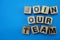 Join our team alphabet letters on blue background