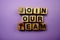 Join our team alphabet letters on purple background