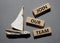 Join our team symbol. Wooden blocks with words Join our team. Beautiful grey background with boat. Business and Join our team