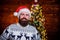 Join party. Cool Santa Claus. Naughty is new nice. Man with beard christmas decorations background. Winter holidays