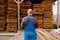 Joiner in uniform check boards on timber mill