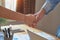 Joint Hands of Two Businessmen After Negotiating a Successful Business Agreement, And the handshake together.