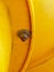 joint point of yellow plastic tubes. Detail of cross of plastic and iron