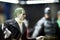 Joker character collectible model and blurred Batman model on the background