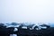 Jokulsarlon Beach Diamond Beach with giant ice rocks on the lava black sand beach.