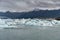 Jokulsarlon Glacier Lagoon in Iceland. Cloudy Sky, Floe and Icebergs and Mountains