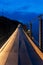 Jolucar suspension footbridge, in Torrenueva Costa, Granada, view of the footbridge in the blue hour, before sunrise with the