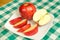 Jonagold apple slices on a white plate