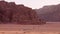 Jordan -15th october, 2022: Wadi rum desert landscape with line of 4wd vehicles drive from sunset viewpoint on organized sunset