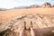 Jordan national park Wadi Rum desert. Beautiful view and panoramatic picture of man legs and outdoor shoes. Natural background. Su