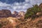 Jordan Petra desert panorama with a toms in the distance and blue sky above. Roman temple