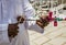 Jordanian Vendor Demonstrates How to Play Native Three String Instrument