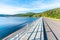 Josefuv Dul Dam, Earth-filled dam in Jizera Mountains with asphalt road on the top, Czech Republic. Sunny summer day