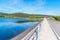 Josefuv Dul Dam, Earth-filled dam in Jizera Mountains with asphalt road on the top, Czech Republic. Sunny summer day