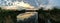 Josh`s Pond in Broomfield Colorado at Sunset reflecting off water, Rocky Mountains in the background