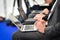 Journalists hands typing on laptops during a press conference