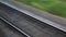 The journey by rail. Shot from the window of a moving train, railroad tracks, rails, sleepers