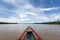 Journey on a wooden boat on Beni river near Rurrenabaque, blue s