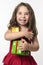 Jovial happy girl child holding presents
