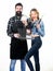 Joy of barbecue style of cooking. Pretty woman and bearded man holding cooking grate. Happy couple using cooking grid