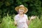 Joy. Friendly Happy Mature Woman in Straw Hut with Stretched Arms