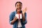 Joyful African Girl Shouting Holding Gift Posing On Pink Background