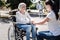 Joyful aged woman being thankful for support