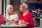 Joyful aged women meeting in the restaurant