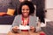 Joyful attractive woman holding a plate with cake