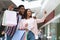 Joyful Black Couple Taking Selfie On Smartphone After Successful Shopping In Mall