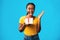 Joyful Black Girl Shouting Holding Birthday Gift Over Blue Background