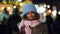 Joyful black girl with sparklers on Christmas holiday market