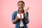 Joyful Black Woman Shouting Holding Birthday Gift On Pink Background