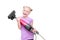 Joyful blond girl holding a vacuum cleaner and fooling to  playing guitar on white background