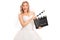 Joyful bride holding a movie clapperboard