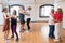 Joyful Caucasian seniors learning couple dance moves
