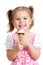 Joyful child girl eats ice cream in studio isolated