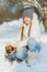 Joyful children playing in snow. Two happy girls having fun outside winter day