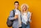 Joyful couple holding passport with tickets and celebrating getting visa