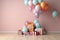 joyful created in the room with birthday decorations, gift boxes and a cluster of colorful balloons.