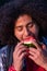 Joyful Delight: Handsome Young Man Enjoying Watermelon Slice