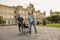 Joyful disabled handicapped mature man can walk again. Recovering patient standing up from his wheelchair, young nurse