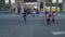 Joyful elementary age kids running to school doors