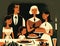 A joyful family gathered around a holiday feast. AI generation