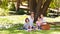 Joyful family picnicking in the park