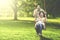 Joyful family playing on swing