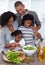 Joyful family preparing dinner in the kitchen