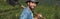 joyful farmer with shovel looking at