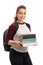 Joyful female student holding a stack of books